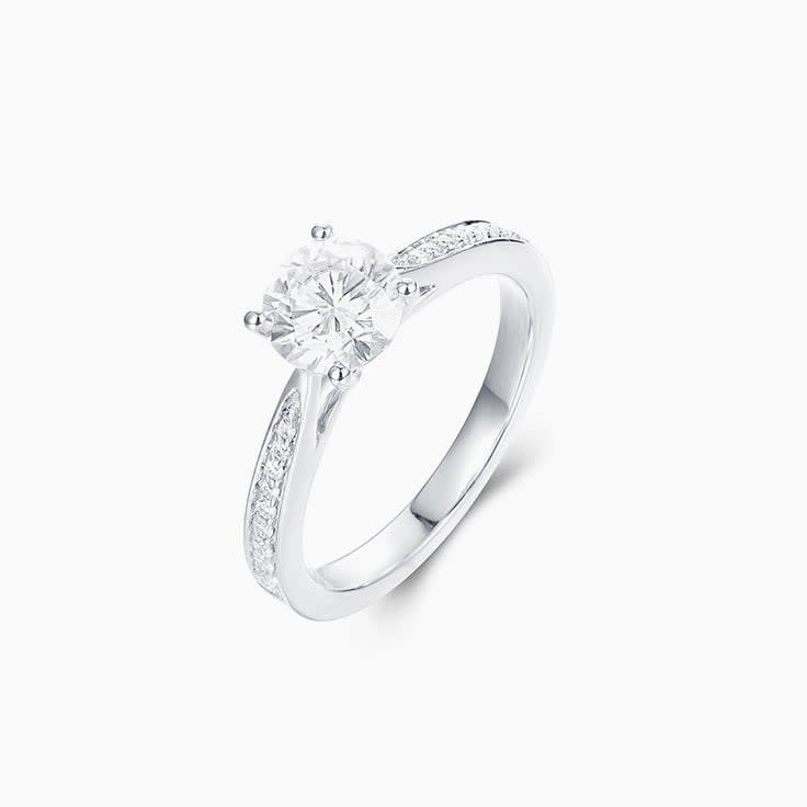 Round Brilliant cut Solitaire with a pave band Engagement Ring