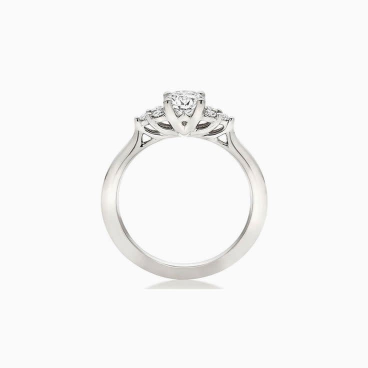 Trilogy setting Round brilliant Diamond Engagement ring