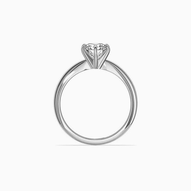 Knife edge engagement ring with round brilliant diamond