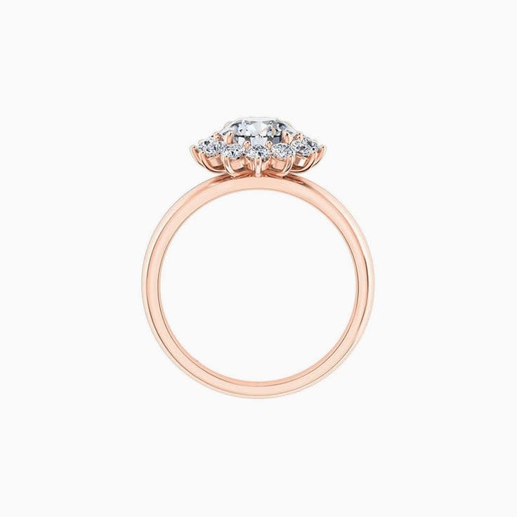 Round brilliant cut engagement ring with floral halo setting
