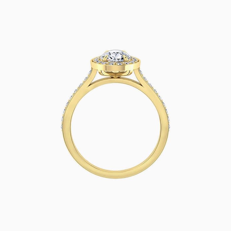 Pear cut diamond engagement ring with pave halo